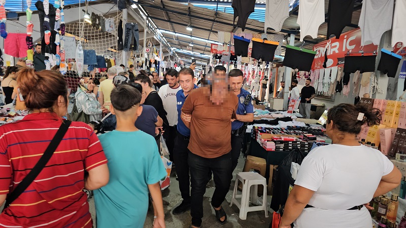Pazar yerinde kadınları çektiği iddia edildi